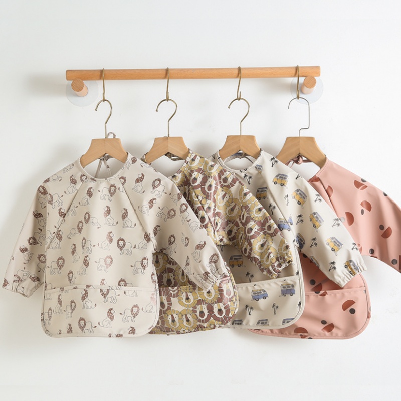 Bavaglino reversibile in PU a  - Bib Long Sleeve recensione e prezzo